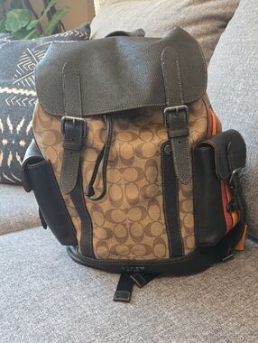 Coach Brown Signature Canvas Backpack with Black Trim and Orange Accent